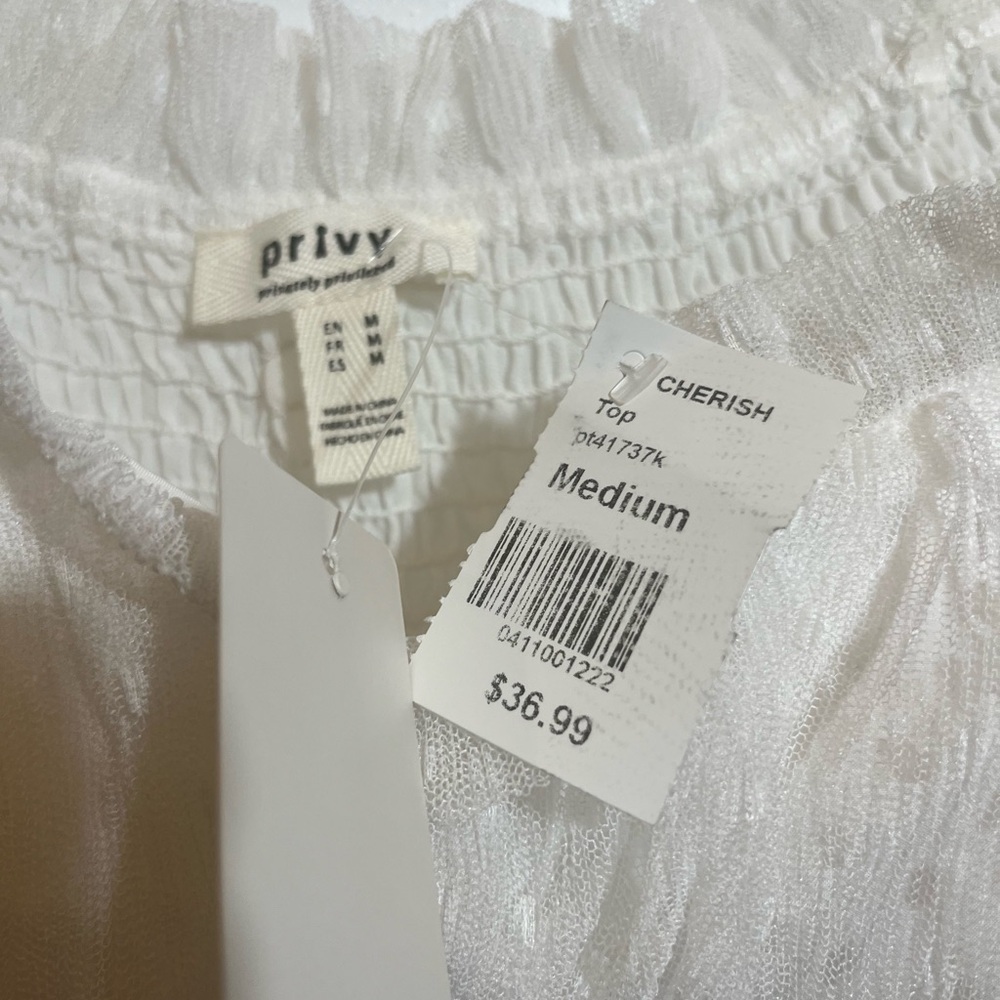 Boho styled, flowery white top size medium sleeveless